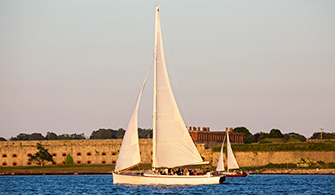 Sloop Eleanor sailing at sunset in Newport RI