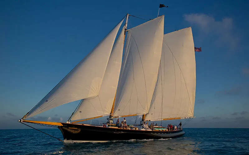 KeyWest_Champagne-Sunset_Slider-1 Schooner America 2.0 sailing in the Ocean in Key West Florida