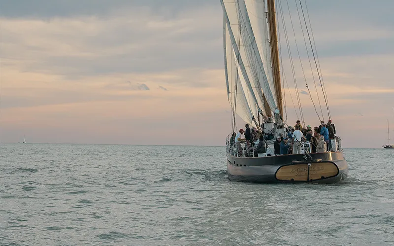 Schooner America 2.0 sailing at sunset in Key West